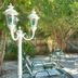Seahorse Cottages on Sanibel - Adults Only poolside patio with lounge chairs and umbrella seating in Sanibel