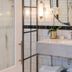Cape Cadogan Boutique Hotel bathroom in Cape Town with marble vanity, tiled walls and round mirror