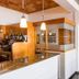 Hotel Mediterrani in Calella de Palafrugell bar area with pendant lights and marble counter
