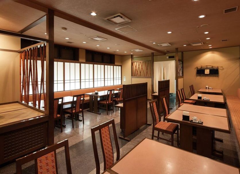 Nara Washington Hotel Plaza restaurant dining room in Nara with tables, chairs and booth seating