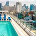 Rooftop pool at Radisson Hotel Chateau de Bangkok with city skyline views in Bangkok