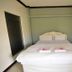 Bangrak Resort in Nakhon Sawan guest room with double bed and wall-mounted air conditioner