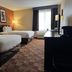 Baymont by Wyndham Plainfield/ Indianapolis Arpt Area room with two beds, desk and window