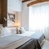 LE 5 Terre LA Spezia guest room with twin beds, neutral decor, and bright window in La Spezia