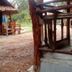 Relax Beach House in Ko Lanta with rustic thatched huts and a sandy walkway through the property