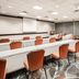 Homewood Suites by Hilton Henderson South Las Vegas meeting room with long tables and orange chairs