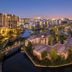 Lawhill Luxury Apartments in Cape Town overlooking a lagoon and island villas at sunset