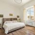 Guest House Maison 6, Lido di Ostia: bright guest room with bed, window city view, and chair