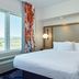 Fairfield Inn & Suites by Marriott Burlington guest room with king bed and window view