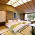 Shuzenji Onsen Katsuragawa room in Izu with tatami floor and mountain view through large windows