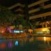 Night view of illuminated pool at Yotau All Suites Hotel in Santa Cruz de la Sierra