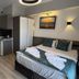 Orange Garden Aparts & Hotel The Nordic in Kemer, hotel room with double bed, kitchenette and wall art