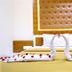Tr Residency in Pondicherry features a bed with towel swans and rose petals