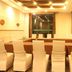 Tizi Hostel in Shanghai meeting room with white-covered chairs and long conference table