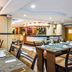 Dining room at Gh Galeria in Guayaquil with set tables and a buffet counter