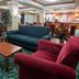 Holiday Inn Express & Suites Milwaukee-New Berlin lobby seating area with sofas, chairs, and tables