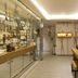 Five Seas by Inwood Hotels in Cannes: modern spa reception with glass shelves and a wooden desk