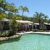 Koala Shores Port Stephens Holiday Park in Taylors Beach with tropical outdoor pool and palm trees