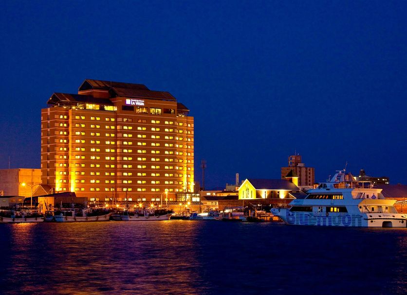La Vista Hakodate Bay in Hakodate lit up at night beside the waterfront and harbor