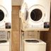 Toyoko Inn Hanshin Amagasaki Ekimae laundry area with stacked washer and dryer in Amagasaki