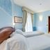 Europa Stabia Hotel guest room in Castellammare di Stabia with two twin beds and a window