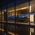 The Blossom Kumamoto in Kumamoto lobby at night, with floor-to-ceiling windows and warm lighting