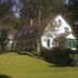 Hotel Buchenhof in Worpswede, white country hotel with green shutters and garden lawn
