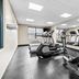 Country Inn & Suites by Radisson Chambersburg, PA fitness room with treadmills and an elliptical