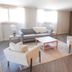 Bryce Uptop Lodge in Bryce lounge with sofa, armchairs, coffee table, and sideboard under windows
