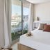 Hotel Indalo Park in Santa Susanna bedroom with balcony view, sliding glass doors, and a neatly made bed