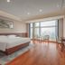 Redstar Culture Hotel Hangzhou guest room with king bed, floor-to-ceiling windows and city view