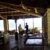 Agriturismo Il Casale Degli Amici in Norcia: rustic covered terrace with tables and countryside view