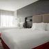 SpringHill Suites by Marriott Beaufort room with two queen beds, large mirror and sheer window curtains