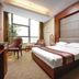 Xiamen Harbor Bay Hotel, Xiamen guest room with king bed, large window, and seating area