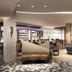 Canal Street New Orleans hotel lobby with seating, bar area, and patterned carpet