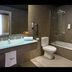 Sercotel Boulevard Vitoria bathroom with bathtub, toilet, glass shower screen and vanity in Vitoria-Gasteiz