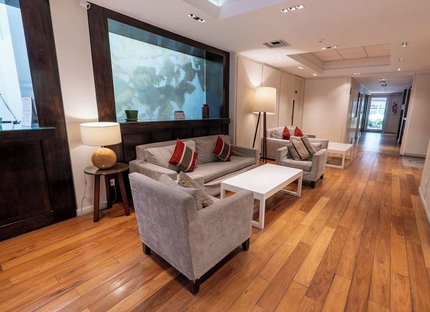 Aparthotel Trianon Recoleta in Buenos Aires lobby lounge with armchairs, sofas, lamps and wood floors