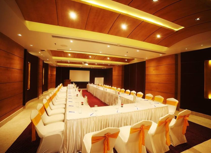 Olive Downtown Kochi meeting room with U-shaped conference table and white chairs