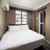 The Quay Hotel Bugis Singapore compact guest room with double bed, window and desk