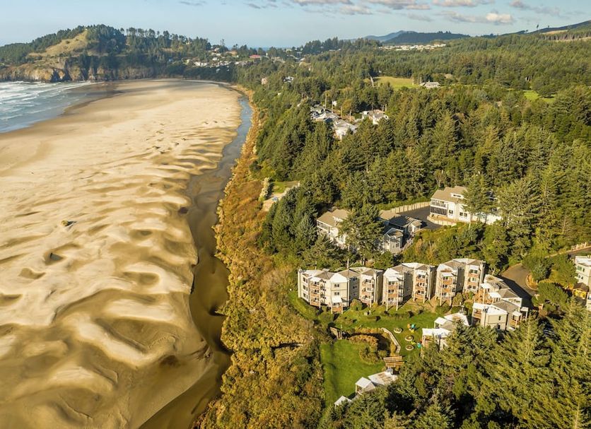Little Creek Cove Beach Resort in Newport with oceanfront cliffside views and sandy beach below