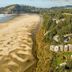 Little Creek Cove Beach Resort in Newport with oceanfront cliffside views and sandy beach below