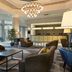 DoubleTree by Hilton Dartford Bridge lobby with chandelier, seating area and reception desk in Dartford
