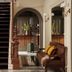 Hotel Belvedere in Kingston interior with dark staircase, arched mirror, and brown bench seating