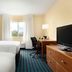 Fairfield Inn by Marriott Kankakee Bourbonnais guest room with two beds, desk, TV and window in Bourbonnais