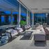 Al Zorah Beach Resort in Ajman lobby lounge with seating and blue bar area