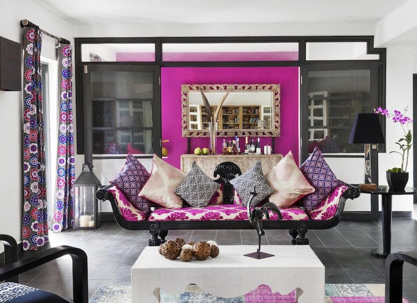 Owl and the Pussycat Hotel & Restaurant in Unawatuna, stylish lounge with magenta sofa and black-framed windows