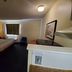 Studio 6 Richmond Va - I-64 West guest room with queen bed, window, and chair in Richmond