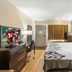 Red Roof Inn Danville, PA guest room with king bed, TV, desk, and window curtains