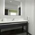 Hampton Inn & Suites El Paso-East bathroom with vanity, mirror, and shower-tub combo