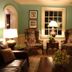 Williamsburg Manor B&B in Williamsburg: cozy sitting room with floral armchairs, lamp-lit window, and fireplace